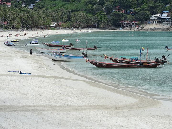 Haad Rin beach with longtail boats